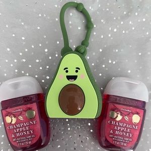 Bath & Body Works. Two Champagne Apple & Honey hand sanitize and avocado case